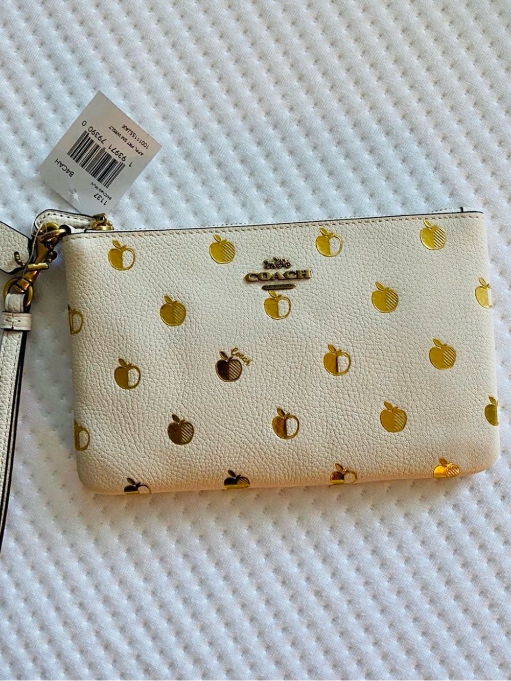 Coach Cream Leather Wristlet with Gold Apple Motif